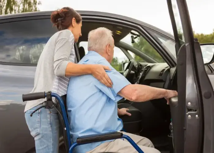 Home 3 Https://Trustedcaringhands.com/ Alt=Caregiver Assisting A Client Into The Car.
